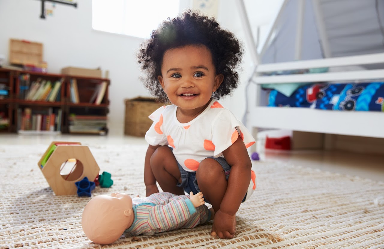 girl with baby doll