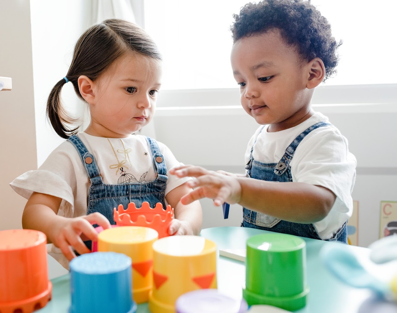 little kids playing with toys