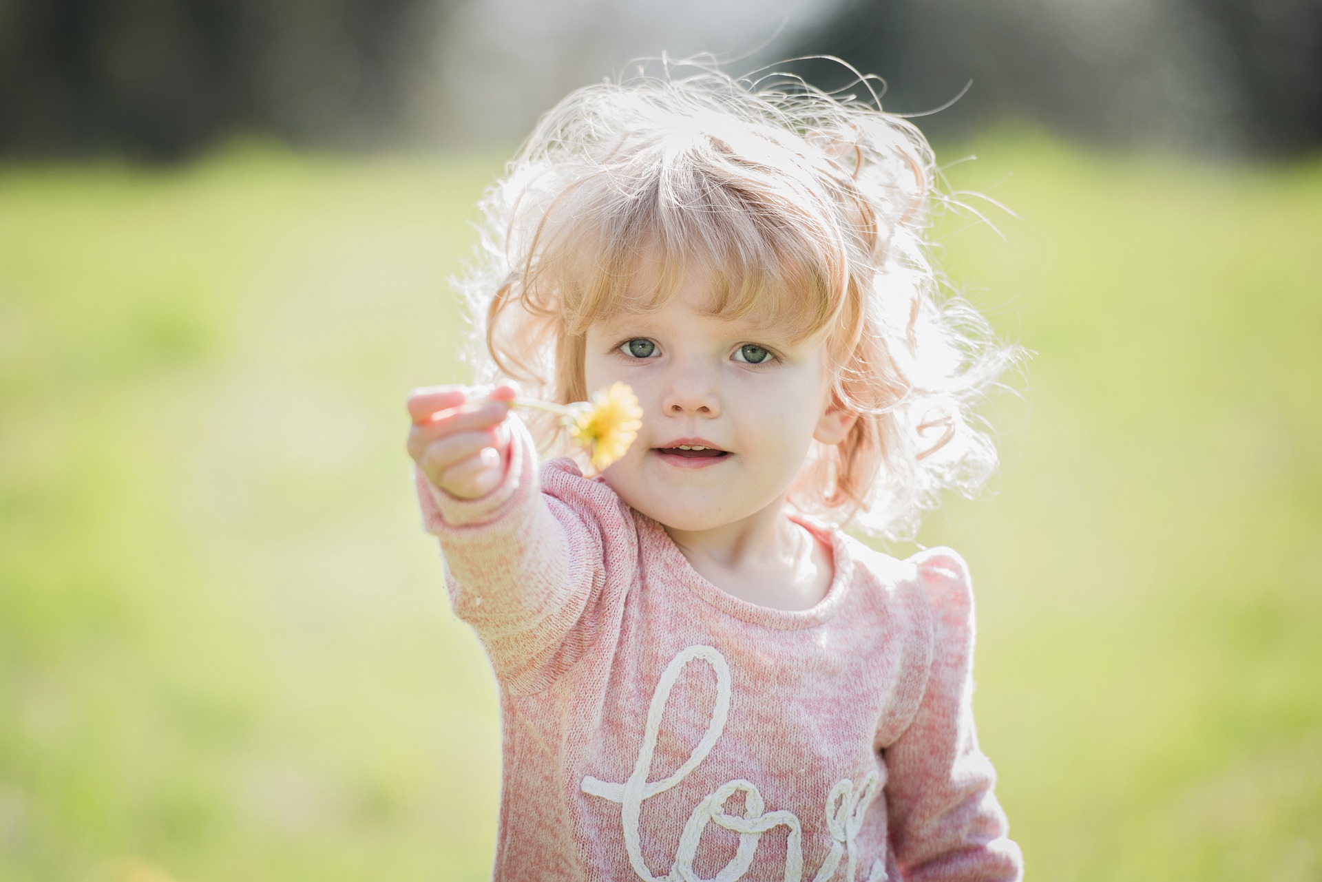 child with a flower